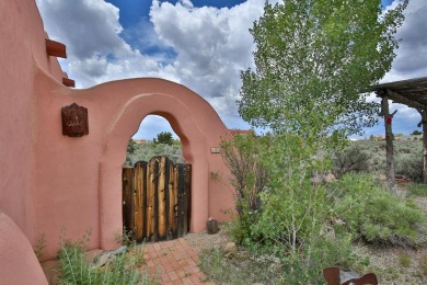 Authentic Adobe - Experience the charm and craftsmanship of true on Taos Country Club in New Mexico - for sale on GolfHomes.com, golf home, golf lot