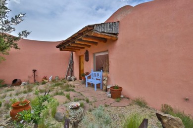 Authentic Adobe - Experience the charm and craftsmanship of true on Taos Country Club in New Mexico - for sale on GolfHomes.com, golf home, golf lot