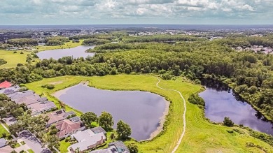 One or more photo(s) has been virtually staged. Nestled on a on Eastwood Golf Club in Florida - for sale on GolfHomes.com, golf home, golf lot