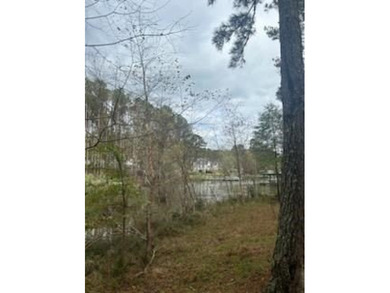 Motivated seller! Build your dream home on this level wooded on The Patriot Golf Club At Grand Harbor in South Carolina - for sale on GolfHomes.com, golf home, golf lot