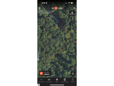 Towering hardwoods in a quiet cul-de-sac location and a large on Cedar River Golf Course in Michigan - for sale on GolfHomes.com, golf home, golf lot