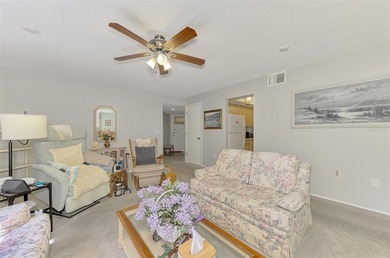 Appealing two bedroom, two bath, first floor, end unit, in the on Capri Isle Golf Club in Florida - for sale on GolfHomes.com, golf home, golf lot