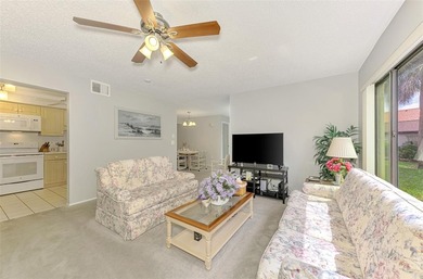 Appealing two bedroom, two bath, first floor, end unit, in the on Capri Isle Golf Club in Florida - for sale on GolfHomes.com, golf home, golf lot