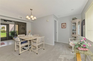 Appealing two bedroom, two bath, first floor, end unit, in the on Capri Isle Golf Club in Florida - for sale on GolfHomes.com, golf home, golf lot