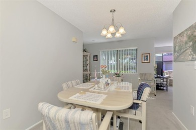 Appealing two bedroom, two bath, first floor, end unit, in the on Capri Isle Golf Club in Florida - for sale on GolfHomes.com, golf home, golf lot