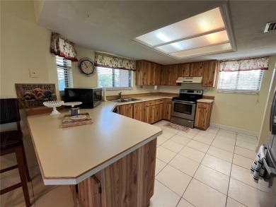 Discover comfort and convenience in this well-maintained on The Club At Pelican Bay - North Course in Florida - for sale on GolfHomes.com, golf home, golf lot