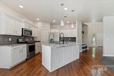 A covered entrance and dramatic vaulted foyer with natural light on Boise Ranch Golf Course, Inc. in Idaho - for sale on GolfHomes.com, golf home, golf lot