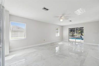 This simply amazing home has been completely remodeled with on Spring Hill Golf Course in Florida - for sale on GolfHomes.com, golf home, golf lot