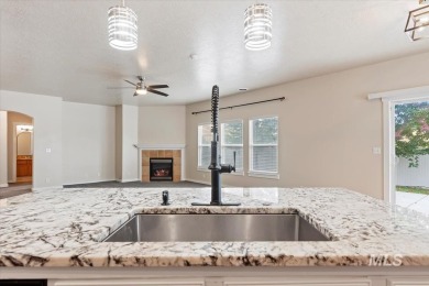 A covered entrance and dramatic vaulted foyer with natural light on Boise Ranch Golf Course, Inc. in Idaho - for sale on GolfHomes.com, golf home, golf lot