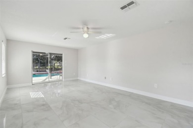 This simply amazing home has been completely remodeled with on Spring Hill Golf Course in Florida - for sale on GolfHomes.com, golf home, golf lot