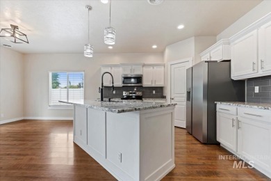 A covered entrance and dramatic vaulted foyer with natural light on Boise Ranch Golf Course, Inc. in Idaho - for sale on GolfHomes.com, golf home, golf lot