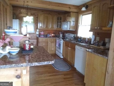 The most adorable, all wood, cabin with a magnificent view in on Sky Valley Resort and Country Club in Georgia - for sale on GolfHomes.com, golf home, golf lot