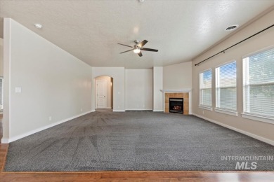 A covered entrance and dramatic vaulted foyer with natural light on Boise Ranch Golf Course, Inc. in Idaho - for sale on GolfHomes.com, golf home, golf lot