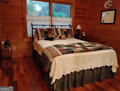 The most adorable, all wood, cabin with a magnificent view in on Sky Valley Resort and Country Club in Georgia - for sale on GolfHomes.com, golf home, golf lot