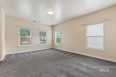 A covered entrance and dramatic vaulted foyer with natural light on Boise Ranch Golf Course, Inc. in Idaho - for sale on GolfHomes.com, golf home, golf lot