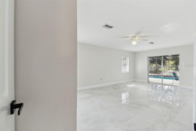 This simply amazing home has been completely remodeled with on Spring Hill Golf Course in Florida - for sale on GolfHomes.com, golf home, golf lot