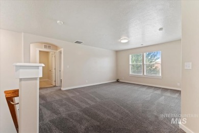 A covered entrance and dramatic vaulted foyer with natural light on Boise Ranch Golf Course, Inc. in Idaho - for sale on GolfHomes.com, golf home, golf lot