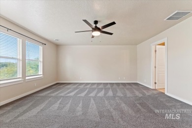 A covered entrance and dramatic vaulted foyer with natural light on Boise Ranch Golf Course, Inc. in Idaho - for sale on GolfHomes.com, golf home, golf lot