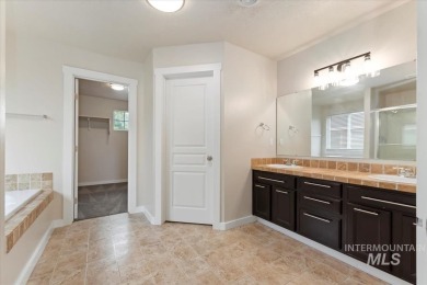 A covered entrance and dramatic vaulted foyer with natural light on Boise Ranch Golf Course, Inc. in Idaho - for sale on GolfHomes.com, golf home, golf lot