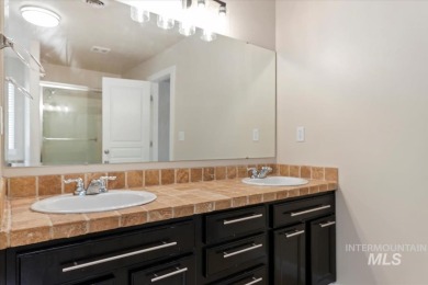 A covered entrance and dramatic vaulted foyer with natural light on Boise Ranch Golf Course, Inc. in Idaho - for sale on GolfHomes.com, golf home, golf lot