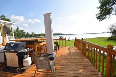 Two-bedroom one bath located on Roy Lake. 1991 14 x 50 mobile on Roy View Golf Course in South Dakota - for sale on GolfHomes.com, golf home, golf lot