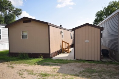 Two-bedroom one bath located on Roy Lake. 1991 14 x 50 mobile on Roy View Golf Course in South Dakota - for sale on GolfHomes.com, golf home, golf lot