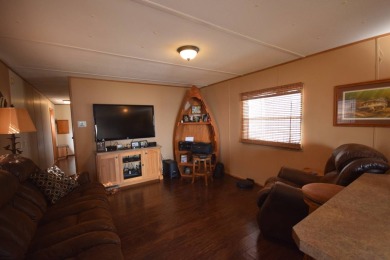 Two-bedroom one bath located on Roy Lake. 1991 14 x 50 mobile on Roy View Golf Course in South Dakota - for sale on GolfHomes.com, golf home, golf lot