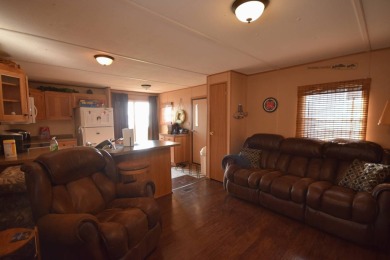 Two-bedroom one bath located on Roy Lake. 1991 14 x 50 mobile on Roy View Golf Course in South Dakota - for sale on GolfHomes.com, golf home, golf lot