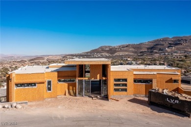 Available by winter 2025, this custom 2-story home is under on Dragon Ridge Country Club in Nevada - for sale on GolfHomes.com, golf home, golf lot