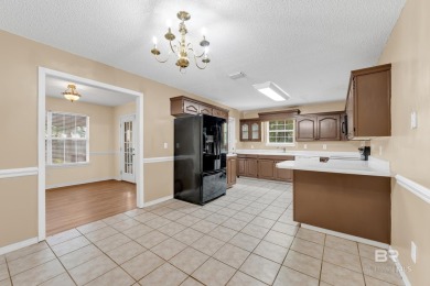 CHARMING three-bedroom, two-bath brick home situated in a quiet on Lake Forest Yacht and Country Club in Alabama - for sale on GolfHomes.com, golf home, golf lot