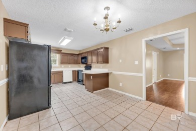 CHARMING three-bedroom, two-bath brick home situated in a quiet on Lake Forest Yacht and Country Club in Alabama - for sale on GolfHomes.com, golf home, golf lot