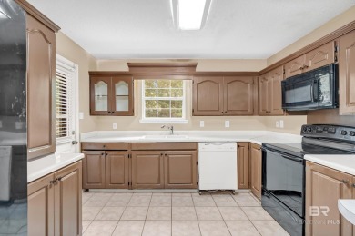 CHARMING three-bedroom, two-bath brick home situated in a quiet on Lake Forest Yacht and Country Club in Alabama - for sale on GolfHomes.com, golf home, golf lot