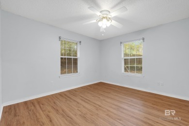 CHARMING three-bedroom, two-bath brick home situated in a quiet on Lake Forest Yacht and Country Club in Alabama - for sale on GolfHomes.com, golf home, golf lot