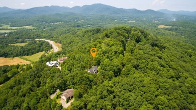 Experience serene living with panoramic mountain and golf course on Brasstown Valley Resort and Spa in Georgia - for sale on GolfHomes.com, golf home, golf lot