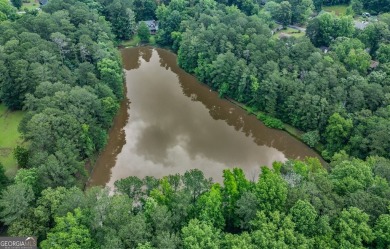 A hidden gem and rare opportunity right off the desirable on Indian Creek Golf Club in Georgia - for sale on GolfHomes.com, golf home, golf lot
