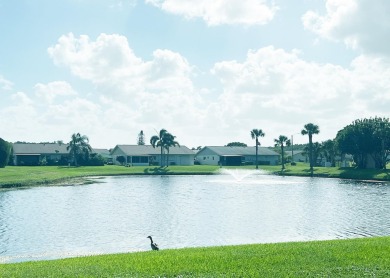 Lowest priced villa in the highly desirable Cypress Lakes on Cypress Lakes Golf Course - West Palm Beach in Florida - for sale on GolfHomes.com, golf home, golf lot