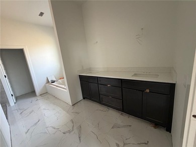 Kitchen has 2cm quartz & marble backsplash, along with stainless on Bella Vista - Metfield Golf Complex and Country Club in Arkansas - for sale on GolfHomes.com, golf home, golf lot