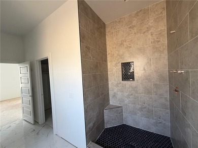 Kitchen has 2cm quartz & marble backsplash, along with stainless on Bella Vista - Metfield Golf Complex and Country Club in Arkansas - for sale on GolfHomes.com, golf home, golf lot