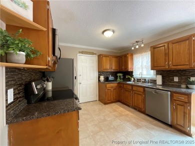 Beautifully maintained 3 BR, 2 1/2 BA home located in the highly on Carolina Lakes Country Club in North Carolina - for sale on GolfHomes.com, golf home, golf lot