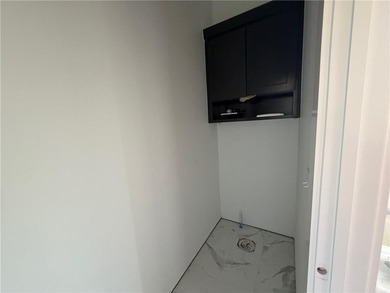 Kitchen has 2cm quartz & marble backsplash, along with stainless on Bella Vista - Metfield Golf Complex and Country Club in Arkansas - for sale on GolfHomes.com, golf home, golf lot