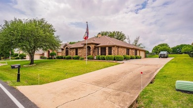 A beautiful Pecan Plantation golf course home sitting on the on Pecan Plantation Country Club in Texas - for sale on GolfHomes.com, golf home, golf lot