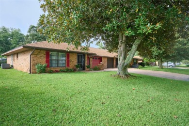 Nestled beneath a stunning magnolia tree in the front  a stately on Sun n Lake Golf and Country Club in Florida - for sale on GolfHomes.com, golf home, golf lot