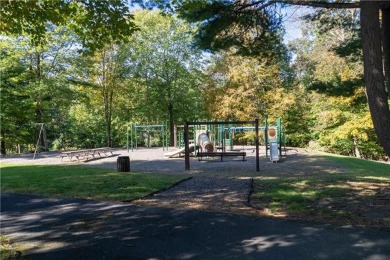 Upscale vacant lot in a community that offers a pool, playground on Country Club of the Poconos Golf Course in Pennsylvania - for sale on GolfHomes.com, golf home, golf lot