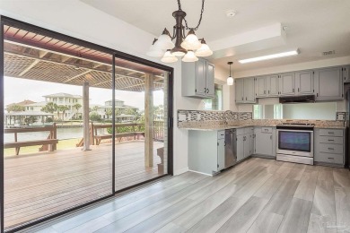 Tucked away in one of Gulf Breeze's most desirable waterfront on Tiger Point Golf and Country Club in Florida - for sale on GolfHomes.com, golf home, golf lot