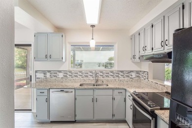 Tucked away in one of Gulf Breeze's most desirable waterfront on Tiger Point Golf and Country Club in Florida - for sale on GolfHomes.com, golf home, golf lot