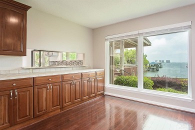 Tucked away in one of Gulf Breeze's most desirable waterfront on Tiger Point Golf and Country Club in Florida - for sale on GolfHomes.com, golf home, golf lot