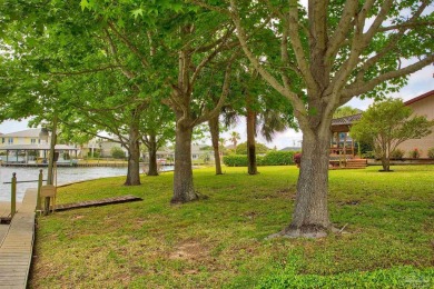 Tucked away in one of Gulf Breeze's most desirable waterfront on Tiger Point Golf and Country Club in Florida - for sale on GolfHomes.com, golf home, golf lot