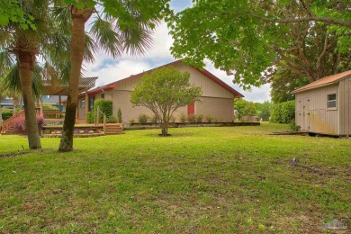 Tucked away in one of Gulf Breeze's most desirable waterfront on Tiger Point Golf and Country Club in Florida - for sale on GolfHomes.com, golf home, golf lot