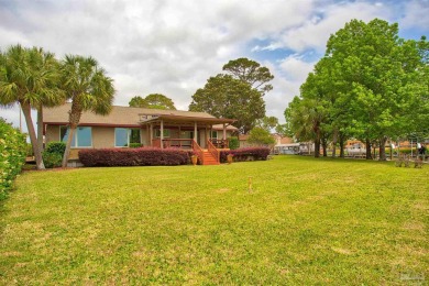 Tucked away in one of Gulf Breeze's most desirable waterfront on Tiger Point Golf and Country Club in Florida - for sale on GolfHomes.com, golf home, golf lot