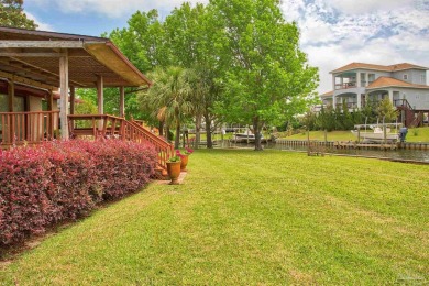 Tucked away in one of Gulf Breeze's most desirable waterfront on Tiger Point Golf and Country Club in Florida - for sale on GolfHomes.com, golf home, golf lot